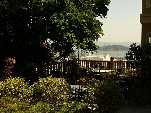 Bay view from private patio. Flowers and shrubs maintained by gardener. Patio furniture included.