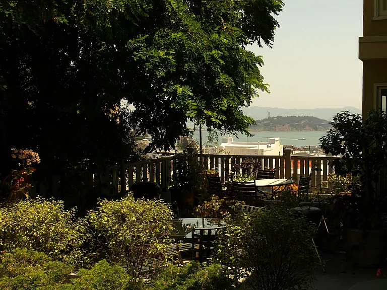 Bay view from private patio. Flowers and shrubs maintained by gardener. Patio furniture included.
