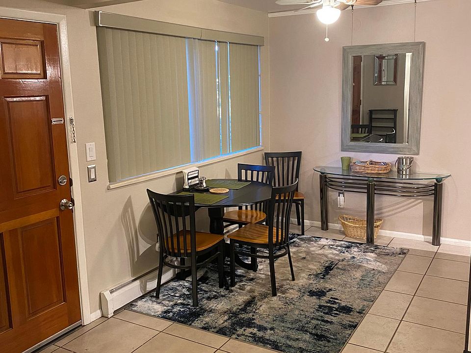 Furnished dining area next to kitchen.
