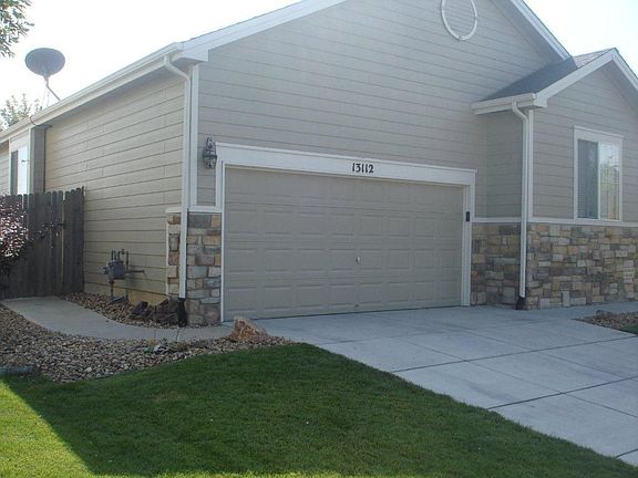 Garage with Sidewalk to Back Yard
