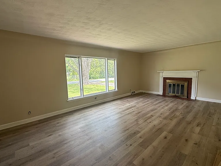 Living Room. Fireplace is just for decor. Non - working.