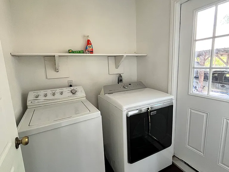 next to kitchen, accessible to bring groceries in from the carport.