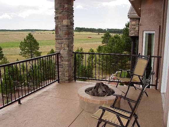 Private veranda with gas fire pit off master