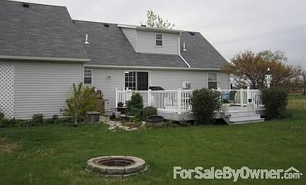 Exterior Back
						:
						Large wooden deck with vinyl railings, fire pit area. Also has shed.