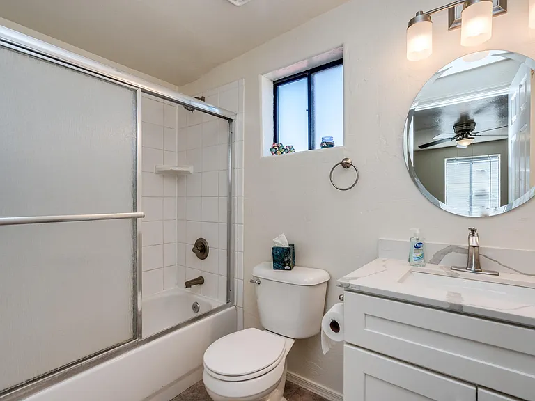 Master bathroom with shower/tub combo. Updated vanity and quartz countertops