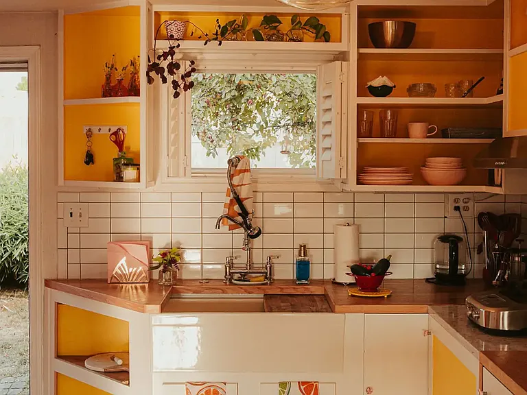 Kitchenette with induction cooktop, microwave, and compact convection oven