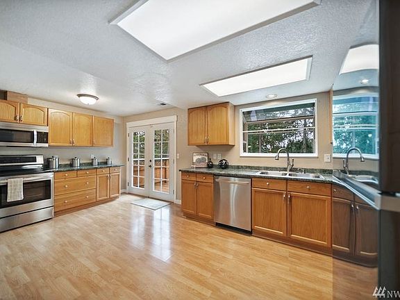 Open kitchen with SS applicances.