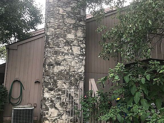 Shaded balcony over patio 