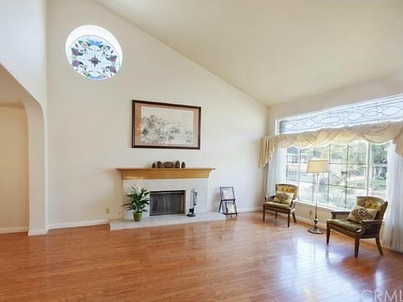 Vaulted ceiling accented by custom stained glass.