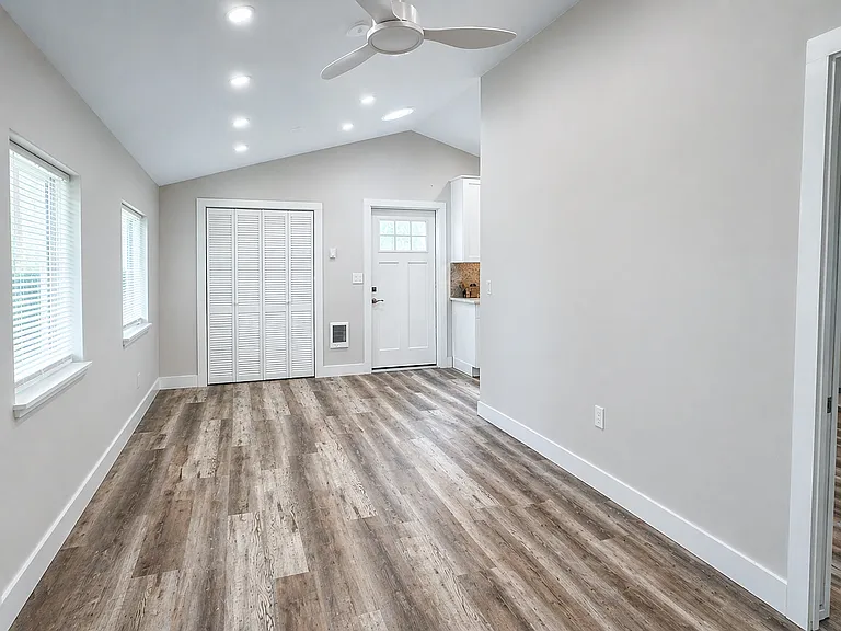 Living Room- Vaulted Ceilings & New Flooring Throughout
