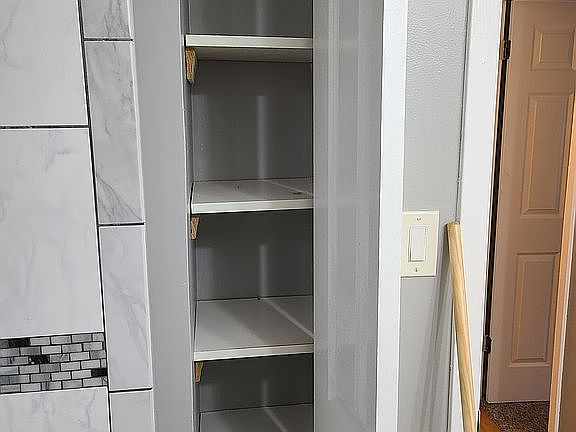 Linen closet in bathroom 