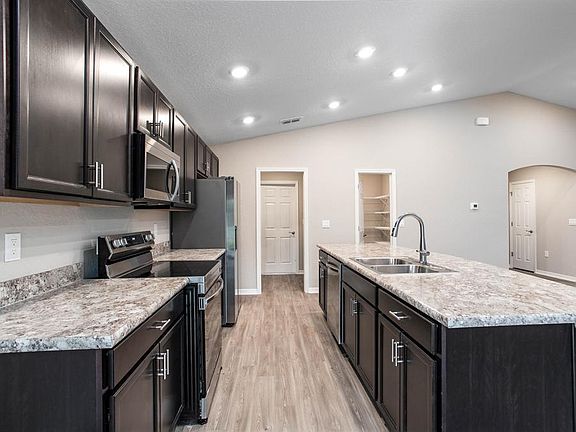 Your new kitchen includes 36-in. cabinets,m Samsung SS appliances, and a walk-in pantry - Waterfront