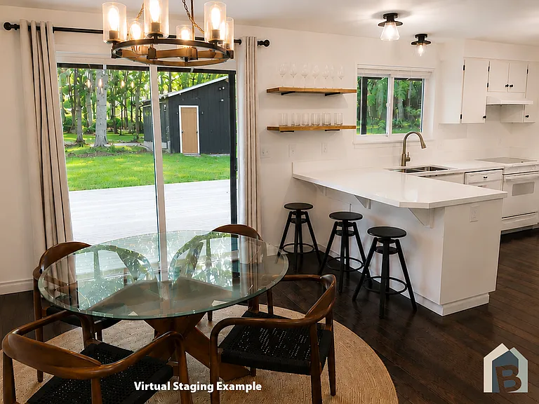 Dining room with glass sliding door to covered large wraparound deck