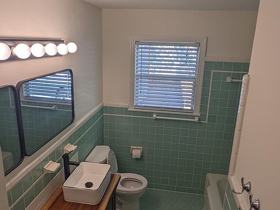 Fully restored bathroom with original midcentury tile