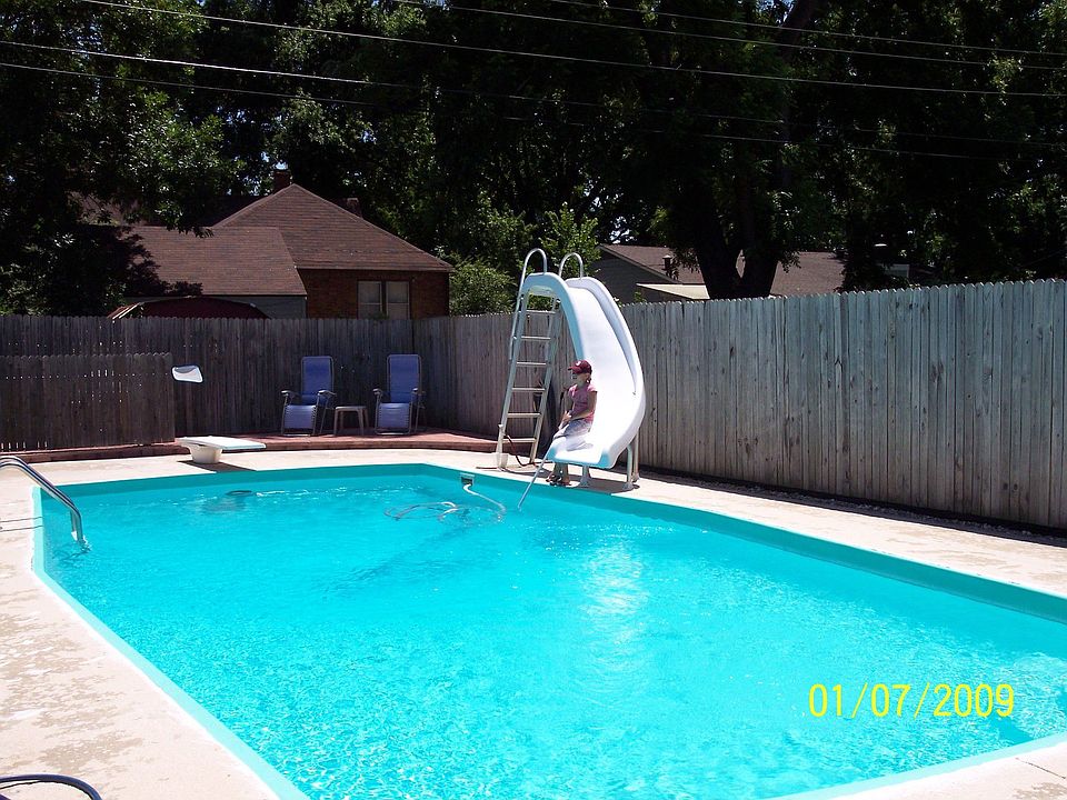 Large Pool with diving board and slide