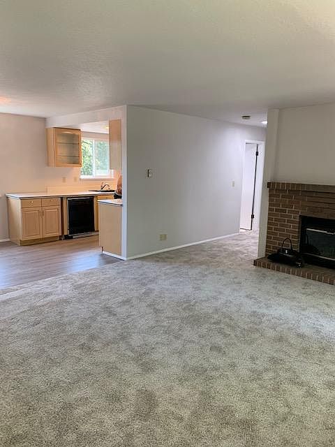 view of living room, hall, and kitchen as you come in the front door. You are facing southeast