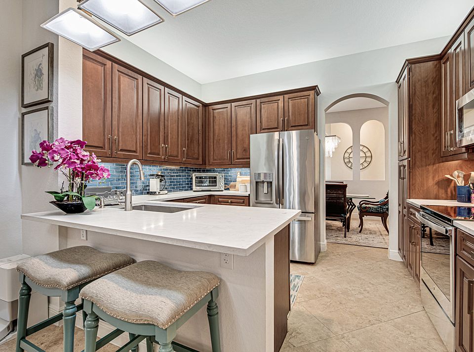 Updated kitchen with single level quartz counters. Pull out drawers and pantry. Upgraded GE profile appliances.