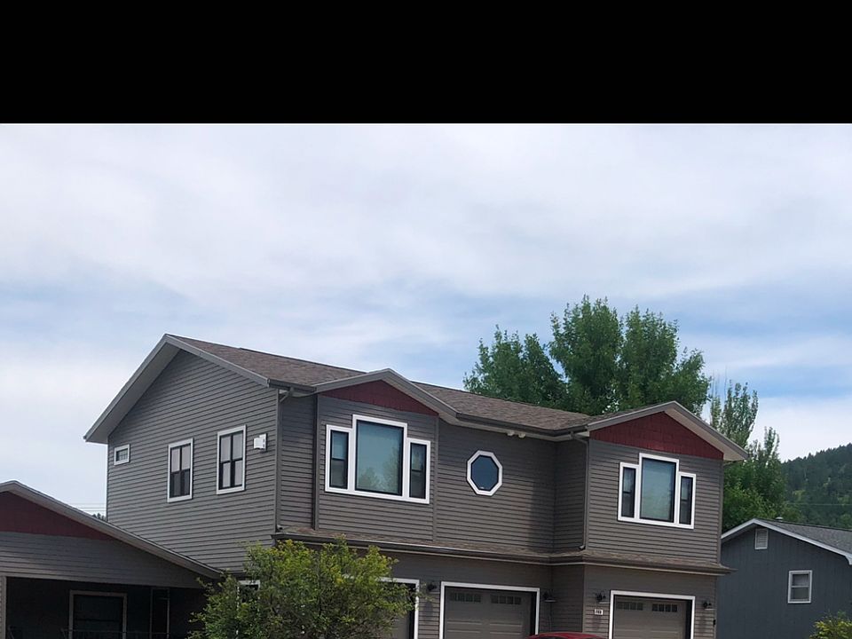 Exterior view of upstairs apartment. The garage on the right is included