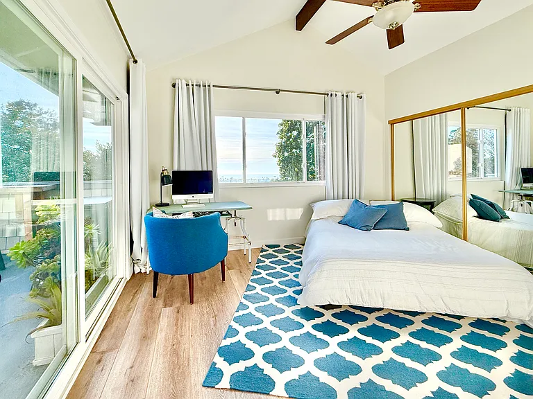Large master bedroom with vaulted ceilings. Master bath has his & hers separate sinks with skylight, letting in natural lighting. Also, another sky light in the separate toilet/shower room.