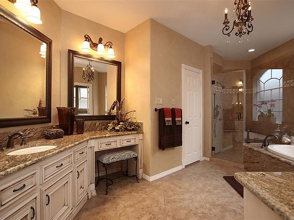 The master bath in this home is truly remarkable. Beautiful shower with seamless glass is one of the many features.