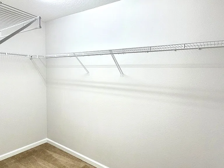 Second Floor Large Walk in closet with storage space.