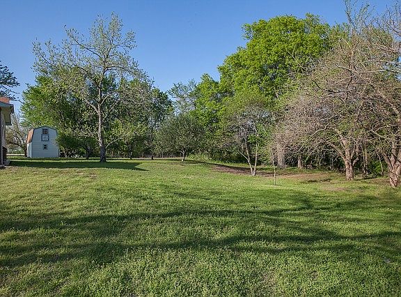 Property contains fruit trees, many mature trees.