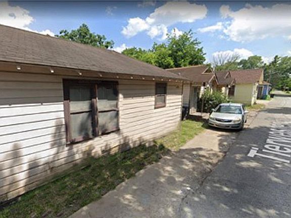Two homes facing Tierwester are visible near the auto. Closest home in the picture and it's neighbor to the left are located on Anita. All 4 homes are for sale in this listing.