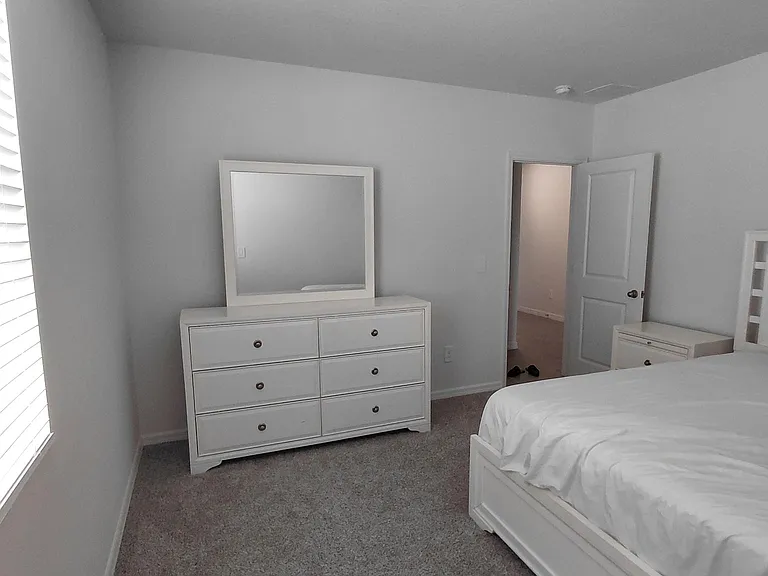 Bedroom 2 has a bed & dresser