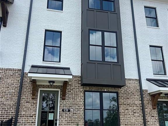 View of front of property with brick siding
