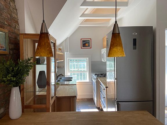 Sunny kitchen with breakfast bar and newer appliances