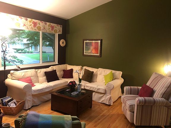 L shaped sofa with additional chairs make a cozy area in front of the fireplace!