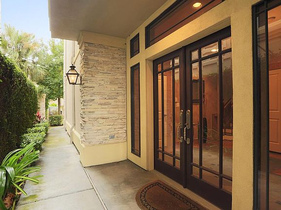 Entry:
Around the right side of the home, up the well landscaped walk leads you to a grand entry. These gorgeous double doors flanked by coordinating windows with beautiful beveled glass set the tone that is followed throughout this home.