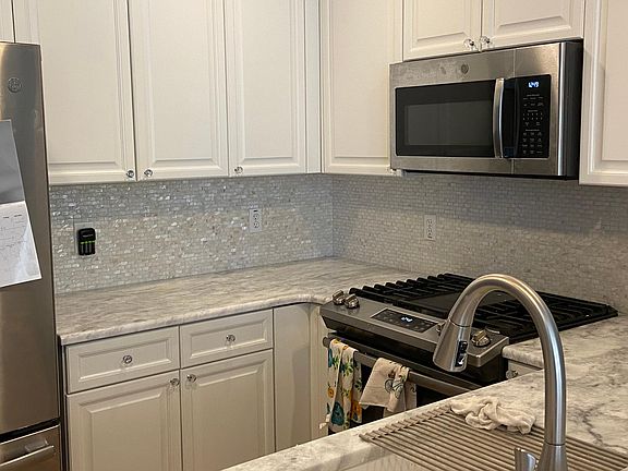 Brand new countertops and stainless steel appliances