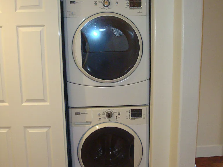 stacked washer and dryer in unit
