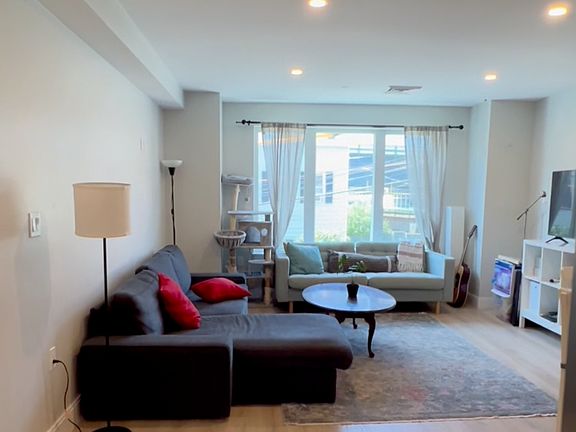 Spacious living room with big window