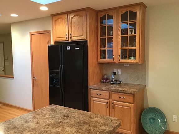 Second view of kitchen with a full walk-in pantry, and all cabinetry have roll-out's for convenience.  The kitchen also has a water purification system that connects to the refrigerator.