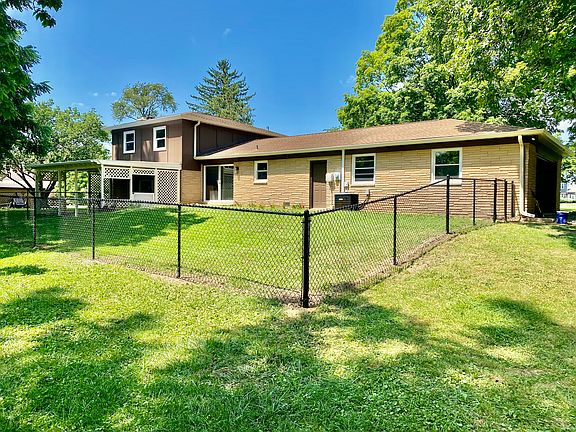 Back of house with new fence
