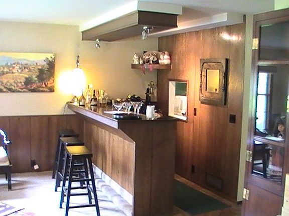 Wet your whistle in this den with wet bar! 