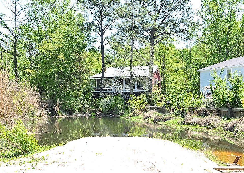Bay cottage nestled in trees