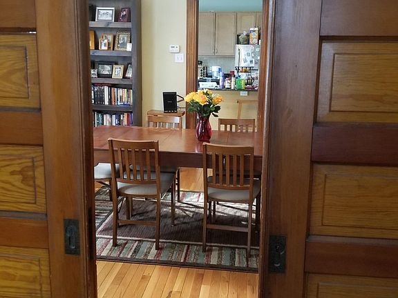 Historic building with wood pocket doors separating LR / DR.