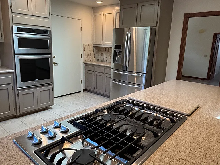 Quartz counter tops and stone & tile backsplash
