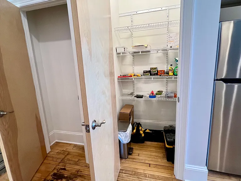 Huuuge pantry closet beside refrigerator (doubles as a temporary tool closet!) and smaller closet to left.