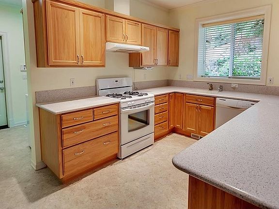 Full kitchen with stove, oven, range hood and dishwasher
