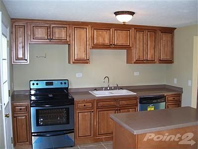 This is another view of your kitchen new cabinets solid surface counter tops new stainless steal gla
