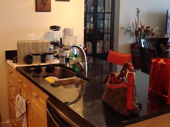 Kitchen w/ granite counter tops and stainless steel appliances