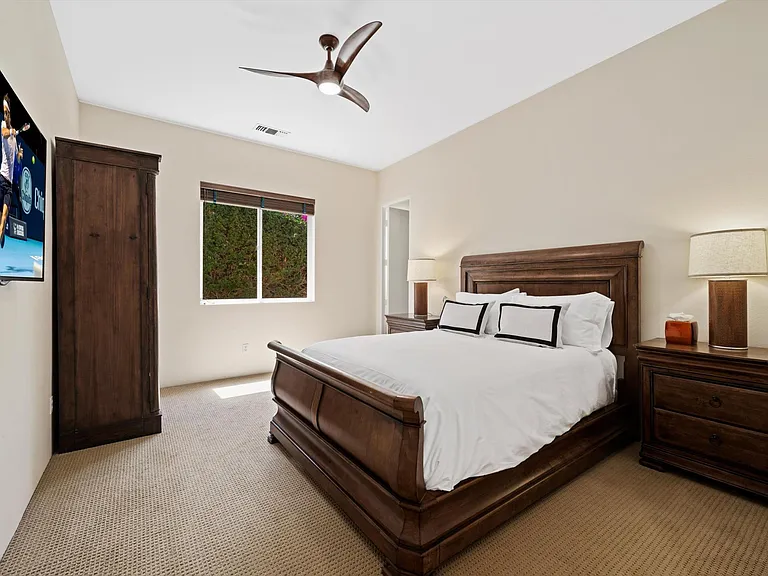 En suite guest room with TV and Frette Luxury Linens
