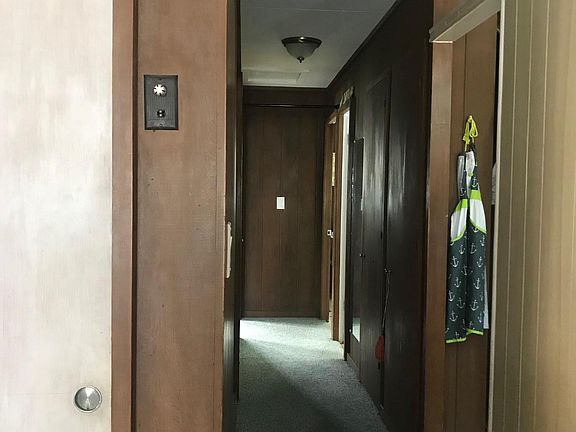 Hallway leading to bedrooms and bathroom