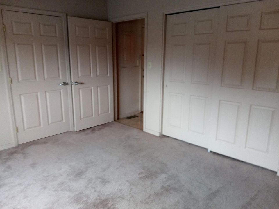 2 walls of storage in bedroom
