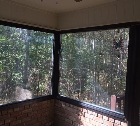 Sunroom : Off of the Great Room. Beautiful view! Stairs to deck exit to the right.