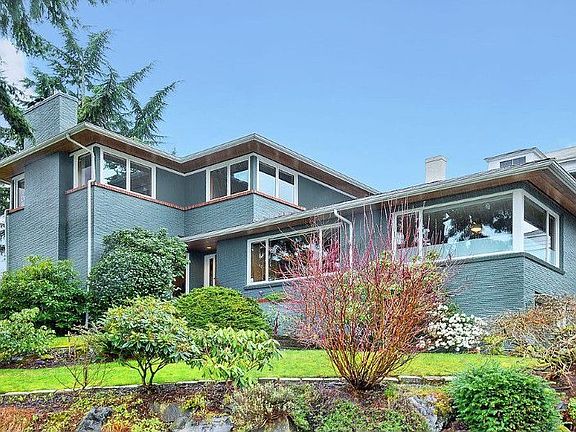 Discover a hidden treasure! Sequestered in a private enclave, this light-filled, architect-designed re-built mid-century home provides a tranquil sanctuary in an extraordinary setting. Rare two-car garage!